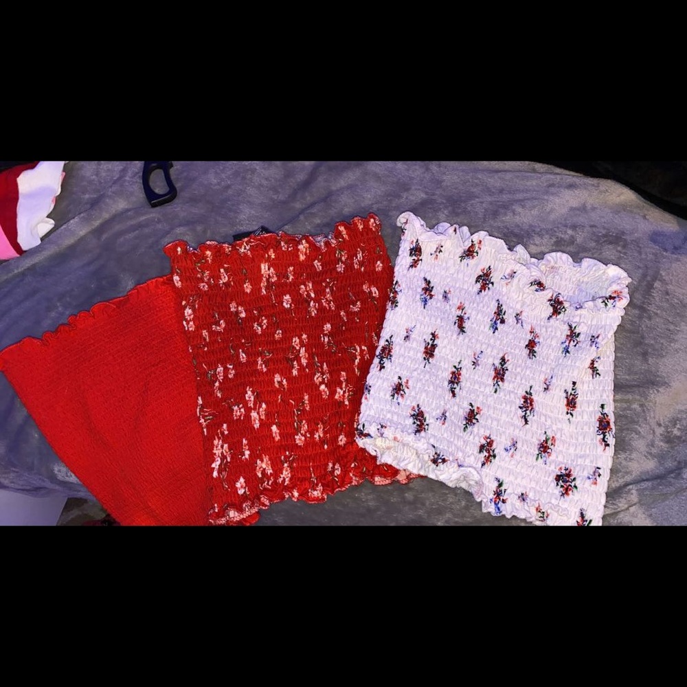 a group of 3 tube tops